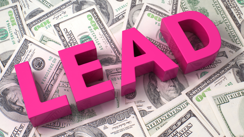 cost per lead image showing the word "LEAD" in bright pink color sitting on top of stacks of dollar bills