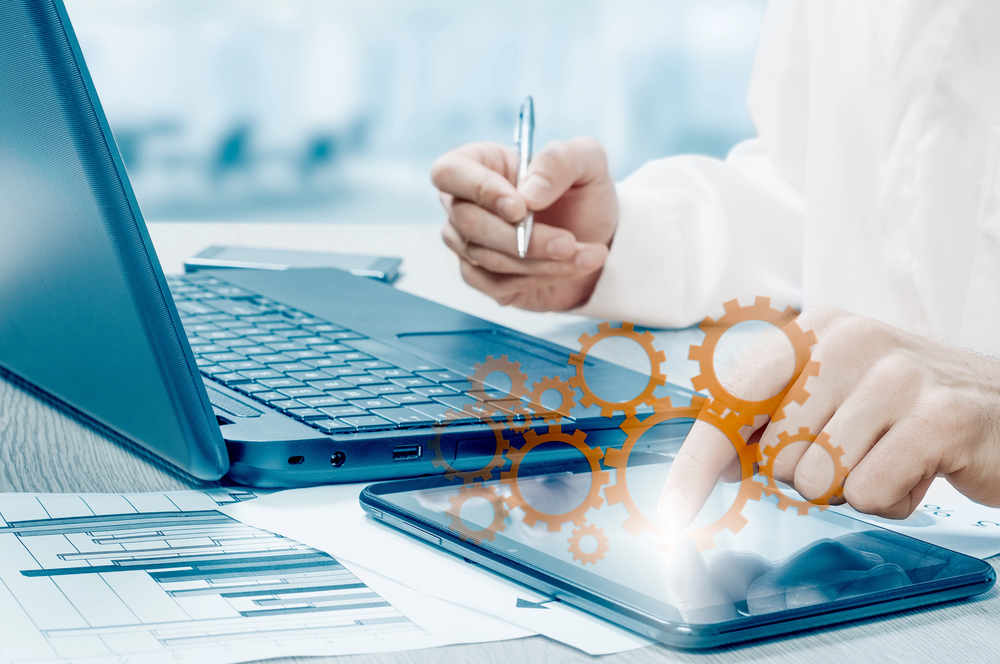 Person using a laptop to work on their process optimization methods.