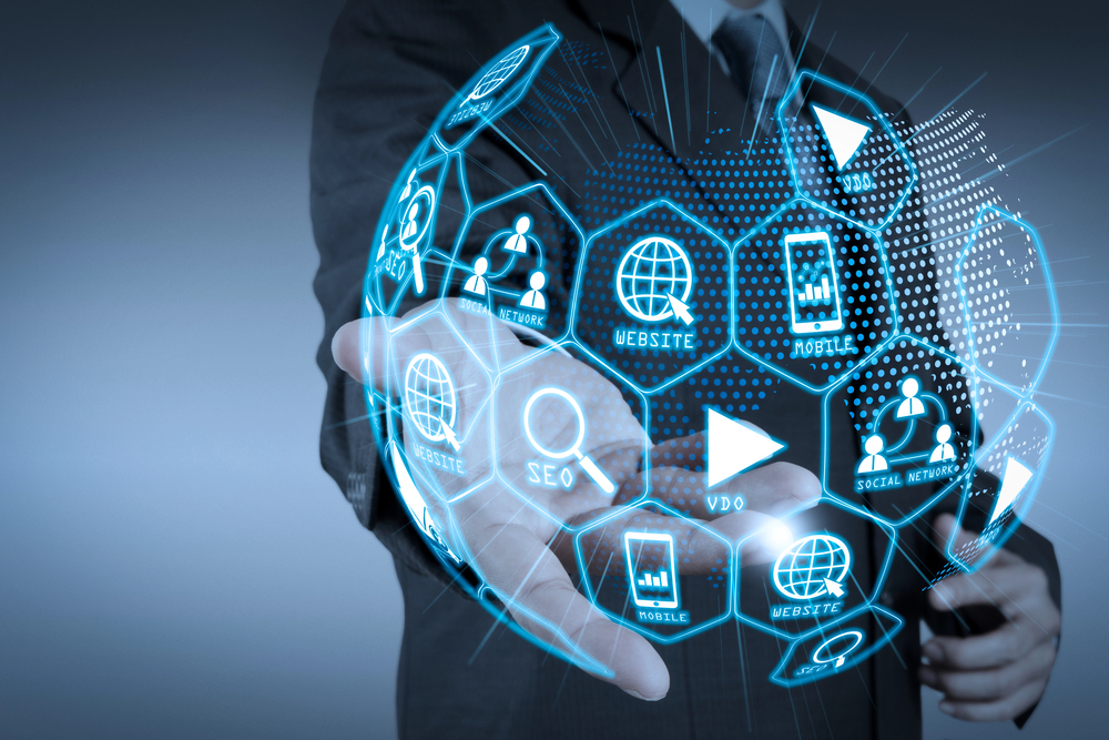 Businessman touching digital marketing icons to review a smart automation strategy.

